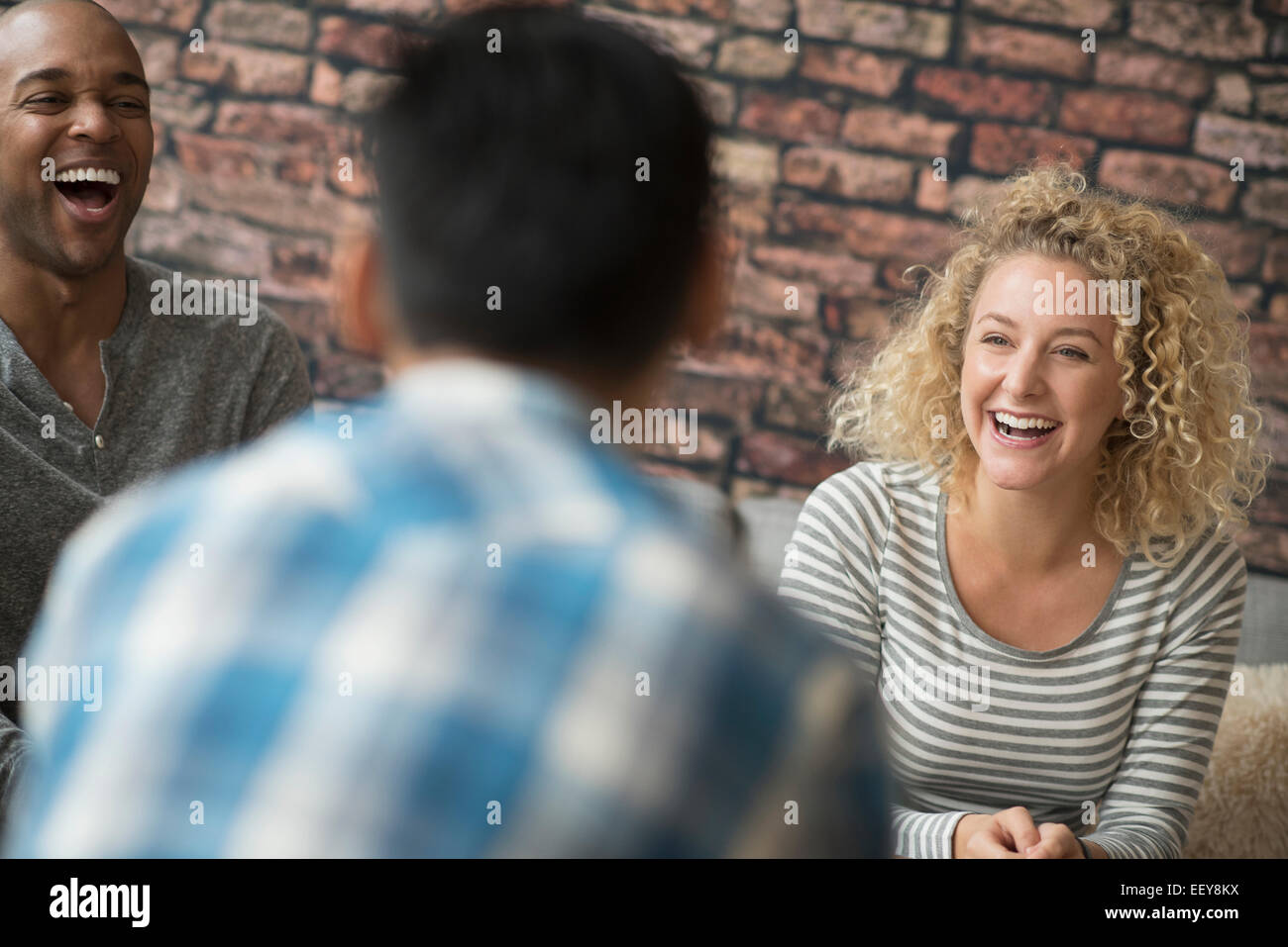 Friends laughing together Stock Photo