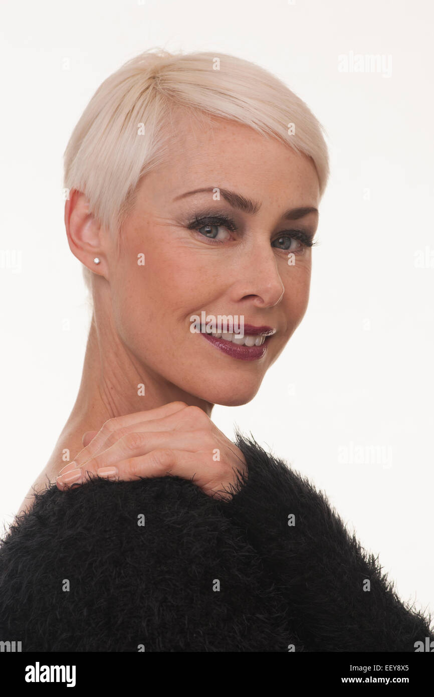 Mature Woman With Short Blonde Hair Smiling Headshot Stock Photo
