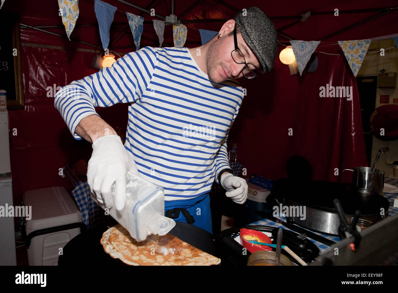 Sugar is added to French crepes at the France Show 2015 in Olympia London Stock Photo