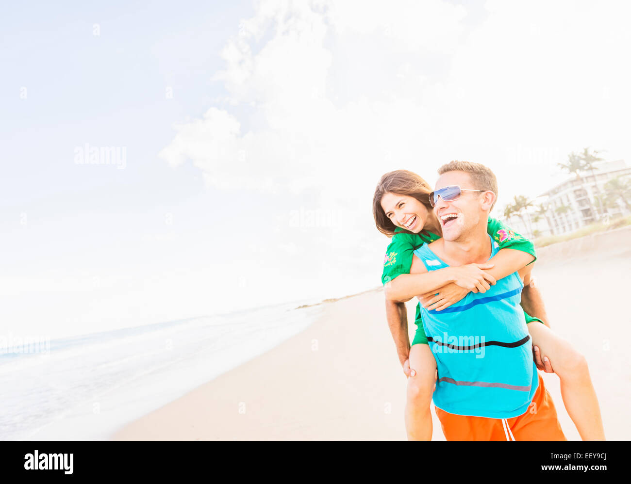 USA, Florida, Jupiter, Young couple doing piggyback ride on beach Stock ...