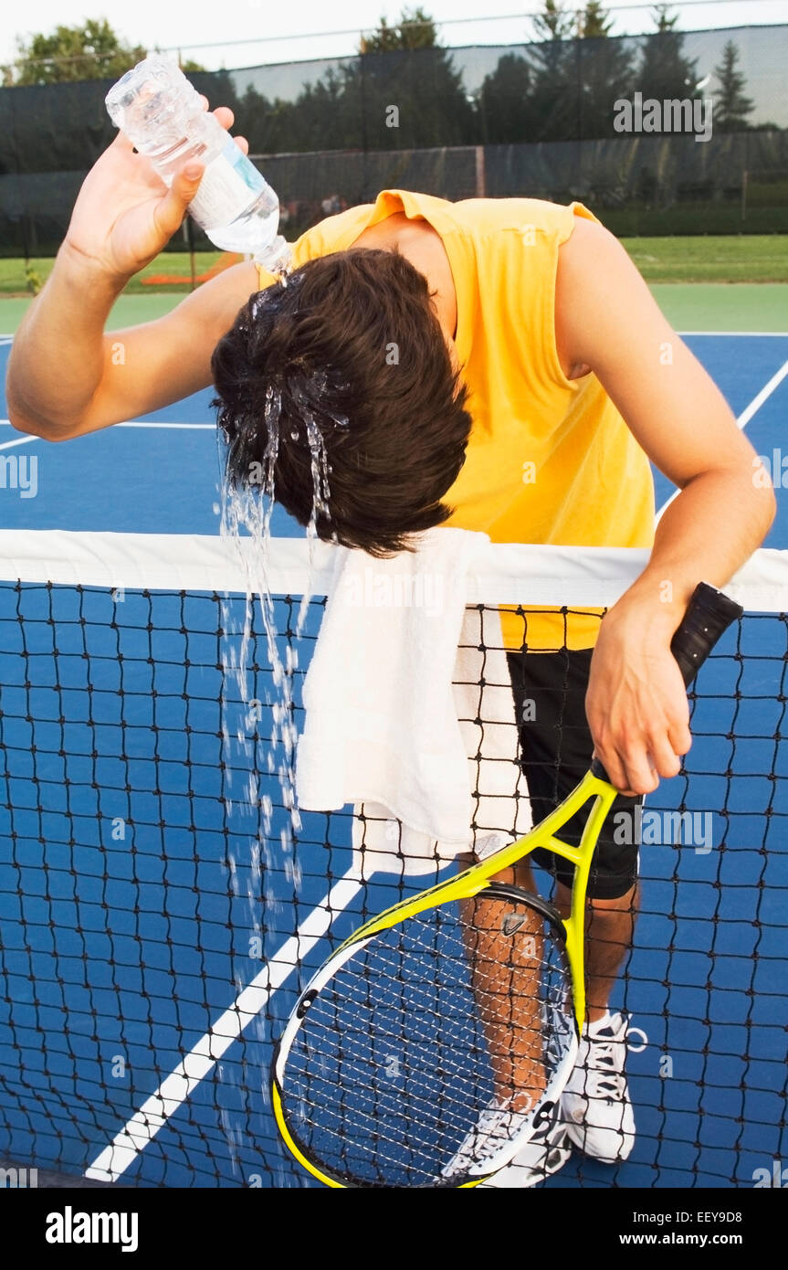 Tennis player alone on a court Stock Photo