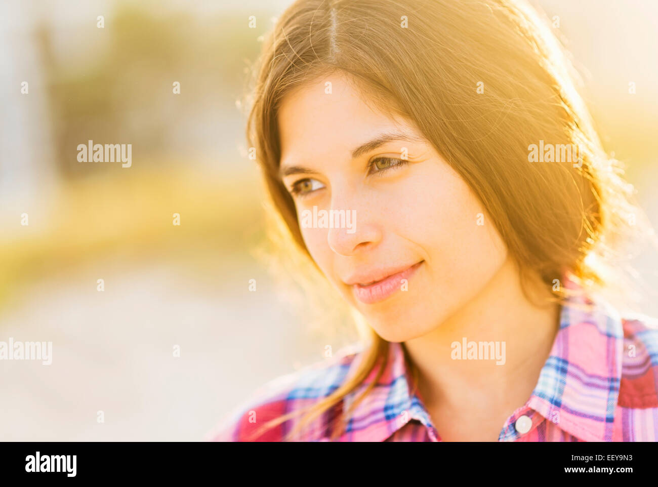 Portrait of young woman in sunlight Stock Photo - Alamy