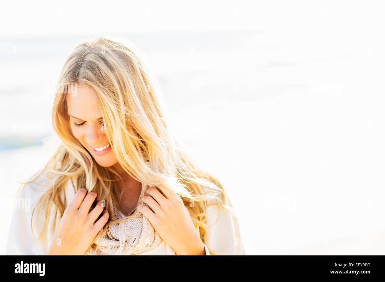 Portrait of smiling woman on beach Stock Photo - Alamy