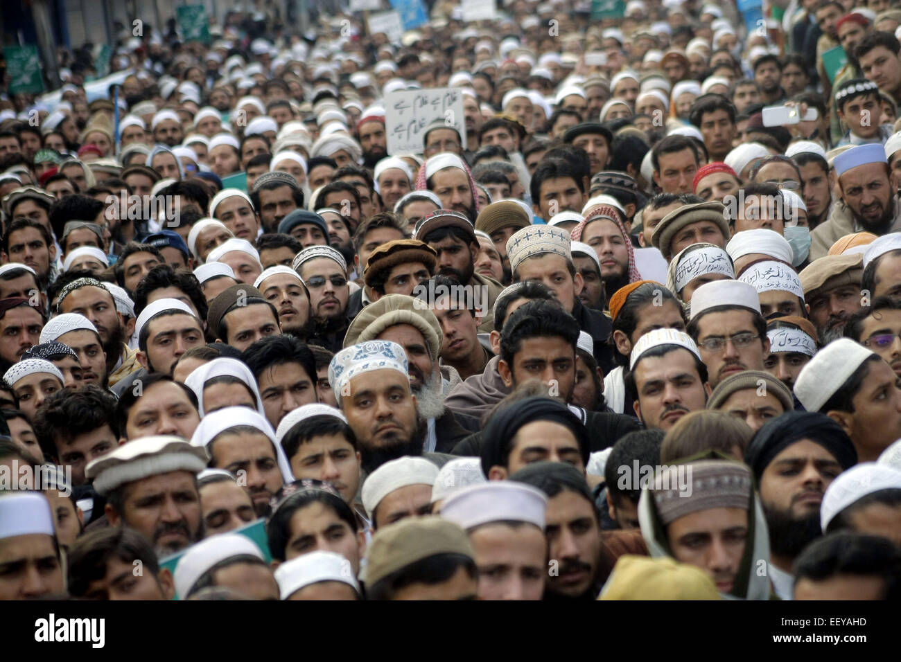 Peshawar. 23rd Jan, 2015. Pakistani people attend a rally to condemn the French satirical weekly Charlie Hebdo for publication of a caricature of Prophet Muhammad, in northwest Pakistan's Peshawar on Jan. 23, 2015. Credit:  Umar Qayyum/Xinhua/Alamy Live News Stock Photo