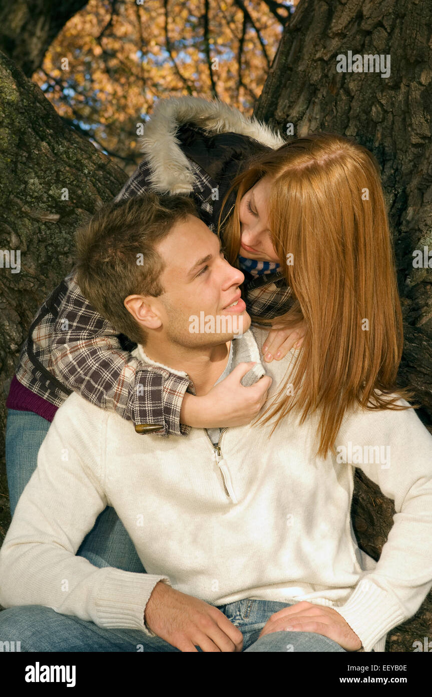 Romantic teenage couple tree in hi-res stock photography and images - Alamy