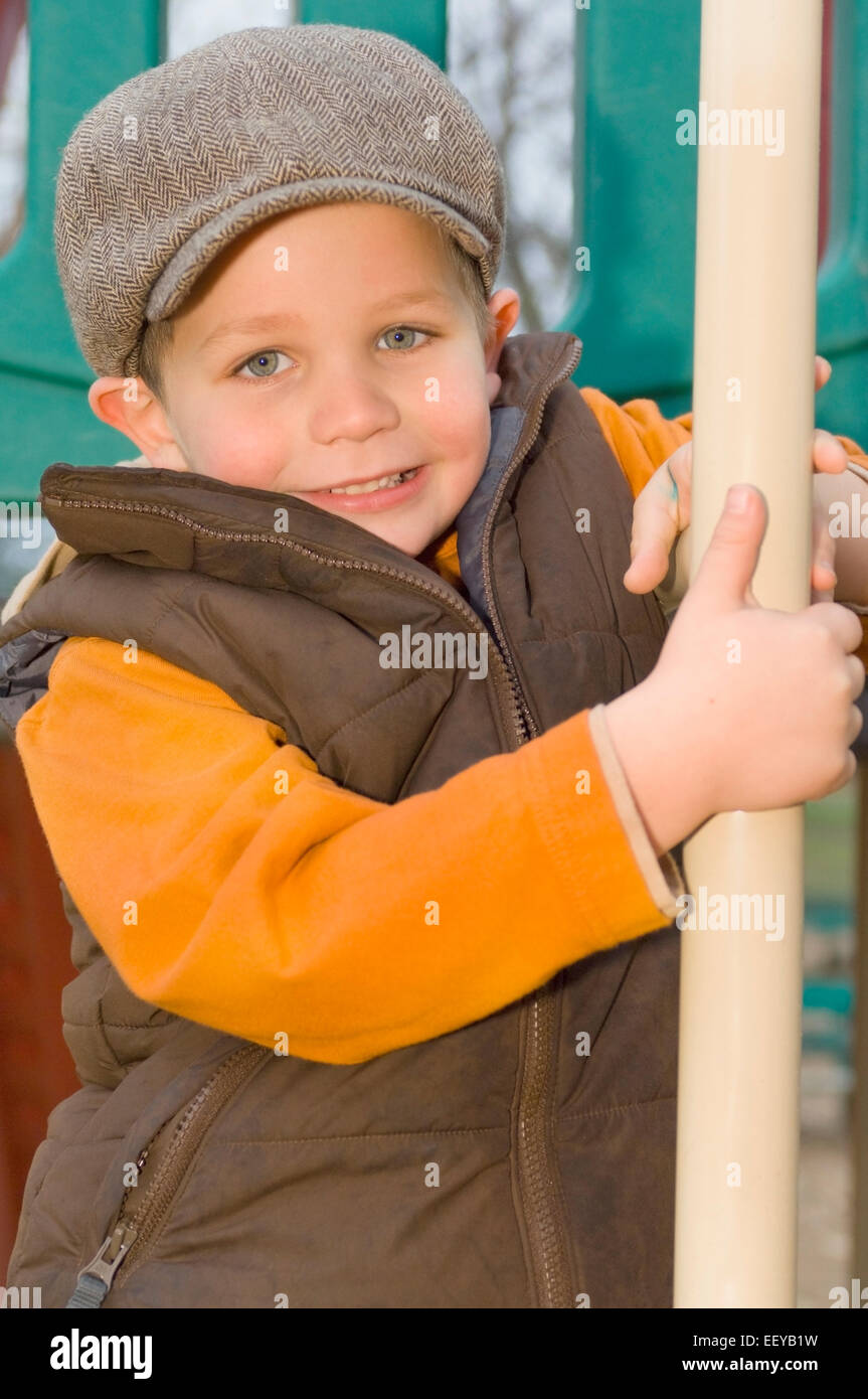 Young boy playing at a playground Stock Photo - Alamy