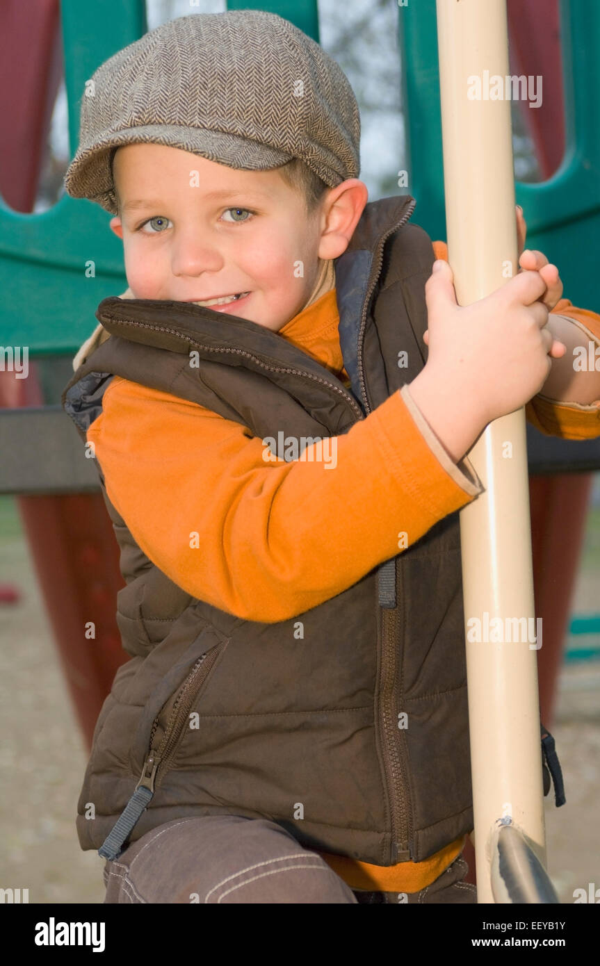 Young boy playing at a playground Stock Photo - Alamy