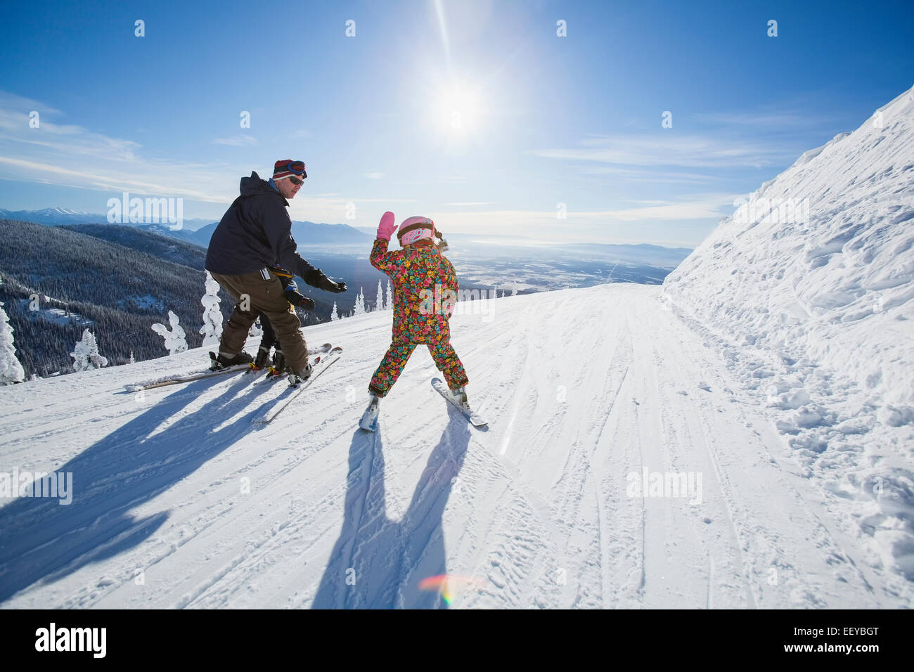 USA, Montana, Whitefish, Father skiing with children (6-7, 8-9) Stock Photo