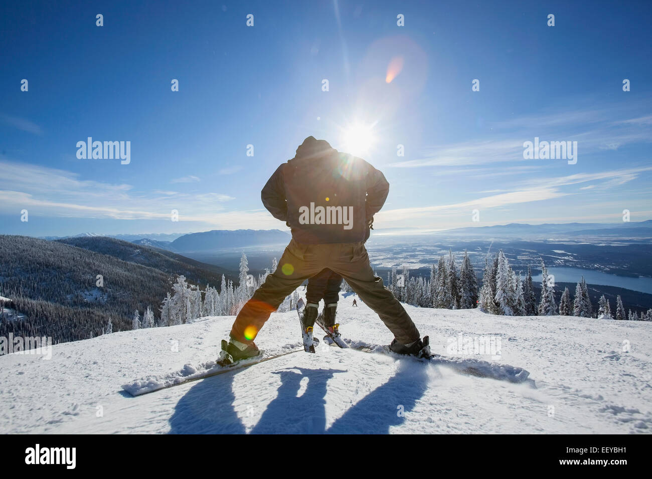USA, Montana, Whitefish, Father skiing with son (6-7) Stock Photo