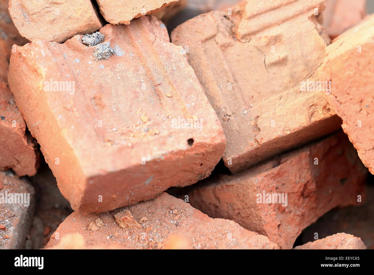 Building materials: red bricks for construction piled on the floor of a street in Godawari-Lalitpur distr.-Bagmati zone-Nepal. Stock Photo