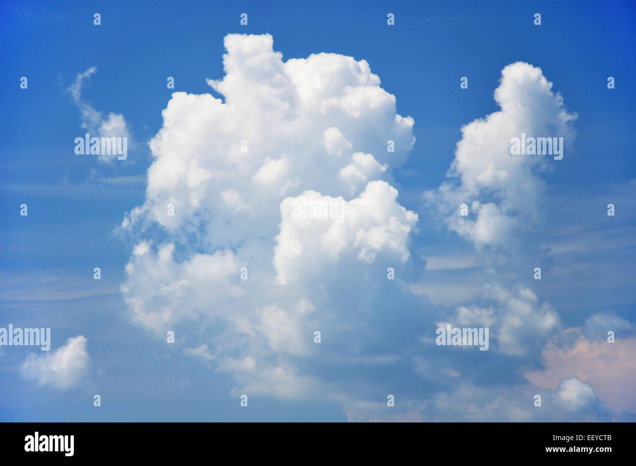 fluffy clouds in blue sky Stock Photo - Alamy