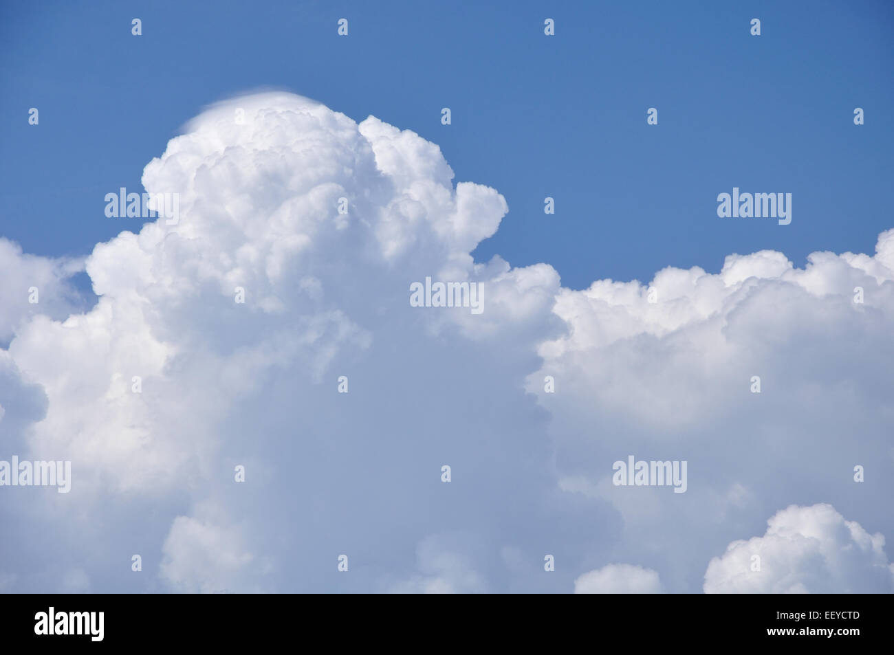 fluffy clouds in blue sky Stock Photo - Alamy