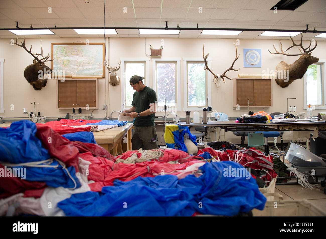 Smoke Jumpers sew their parachutes in the training center in MIssoula