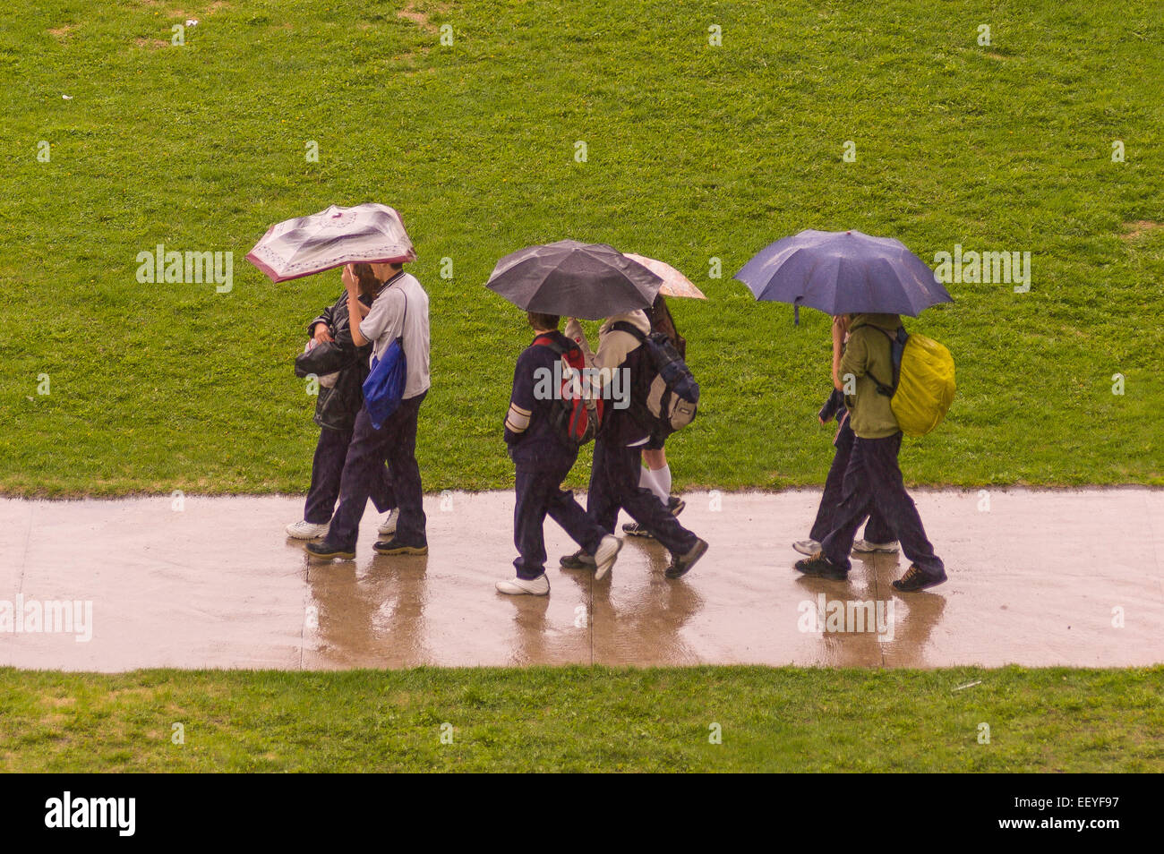 QUEBEC CITY, QUEBEC, CANADA - People with umbrellas in rain. Stock Photo