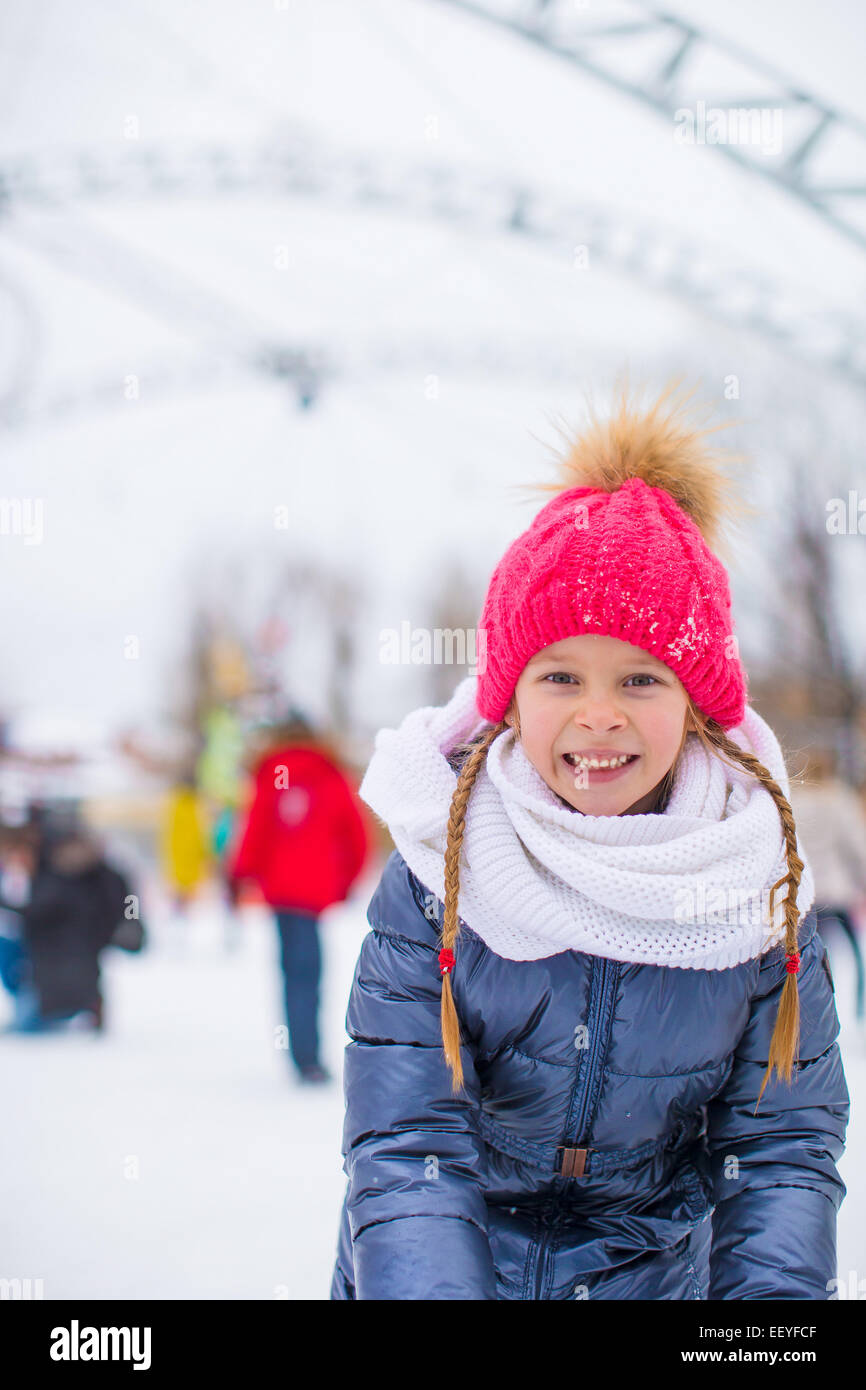 Adorable little girl skating on the icerink Stock Photo Alamy