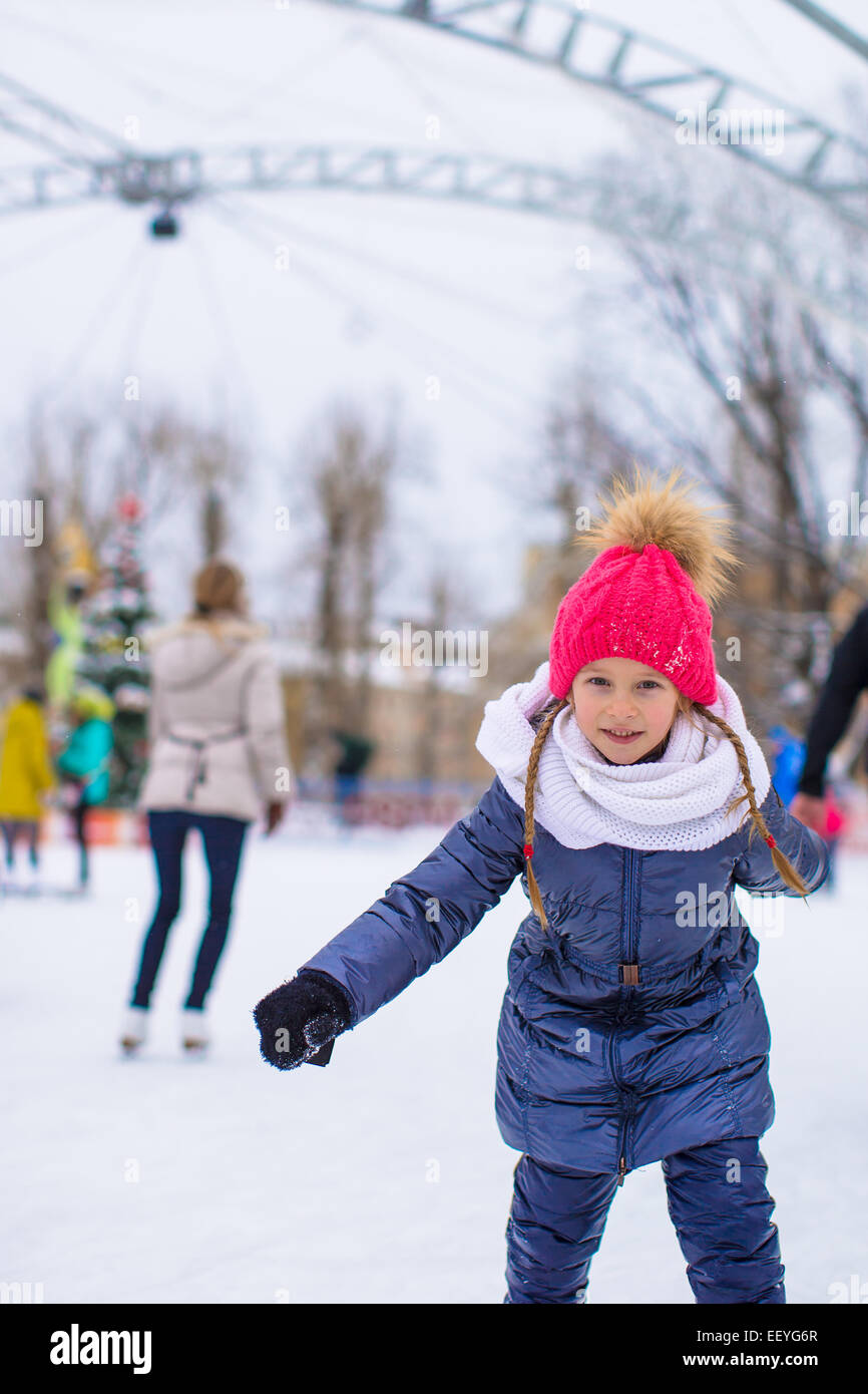 Adorable little girl skating on the icerink Stock Photo Alamy