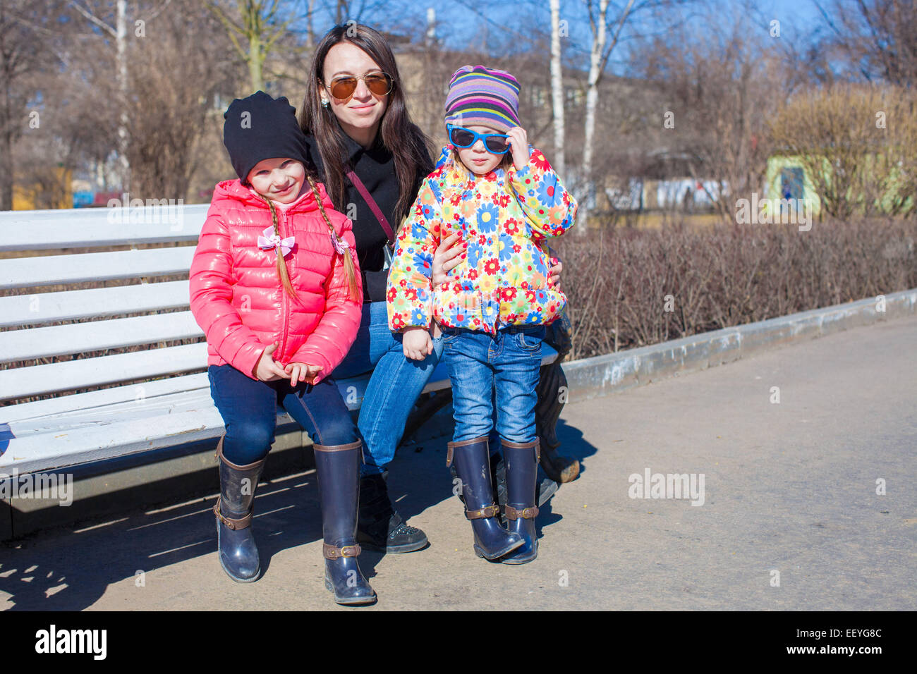 Little girls and young mother have fun outdoors Stock Photo - Alamy