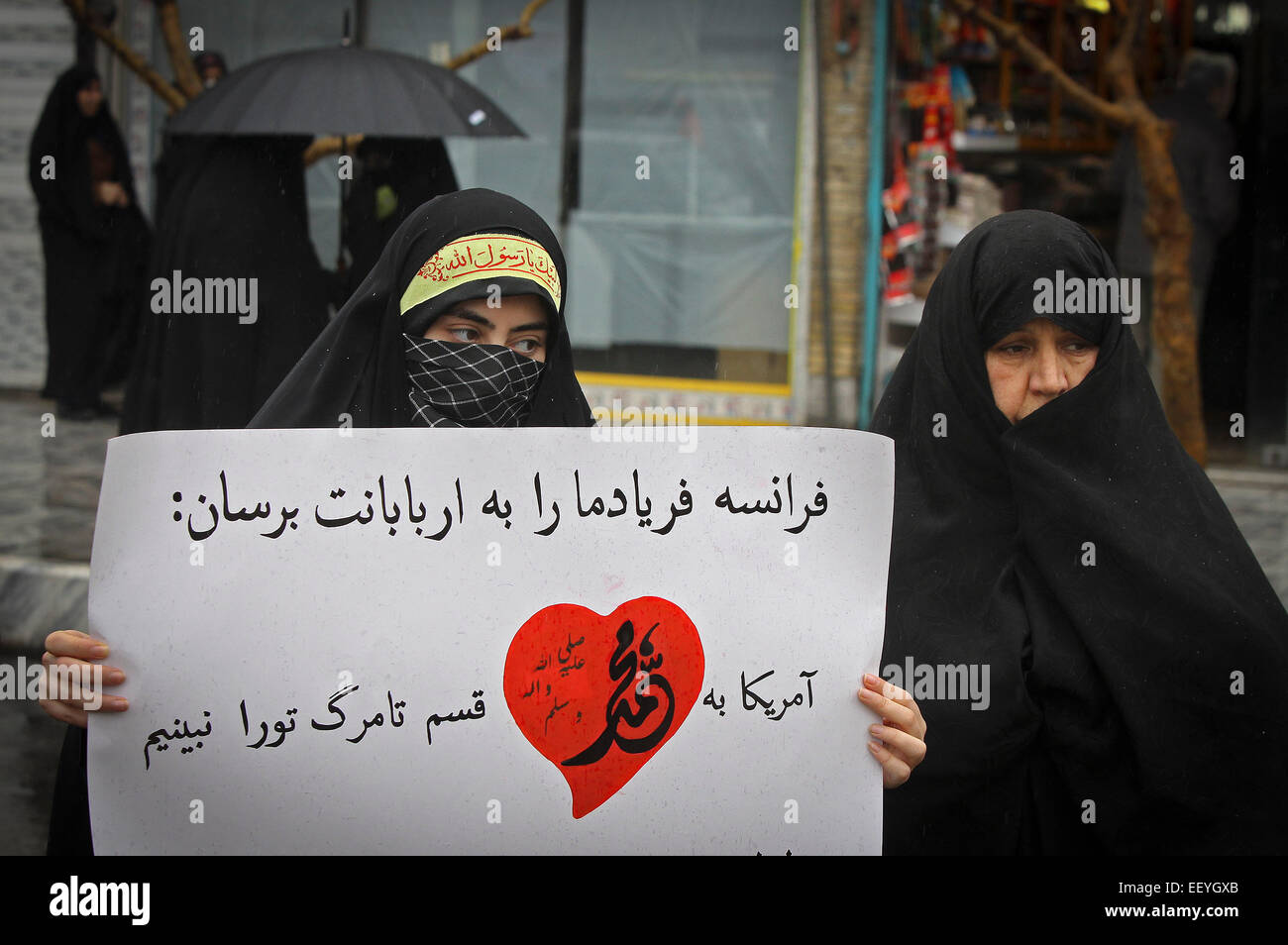 Mashhad, Iran. 23rd Jan, 2015. Iranian women take part in a protest against the printing of satirical sketches of the Prophet Muhammad by French magazine Charlie Hebdo in Mashhad, Iran, on Jan. 23, 2015. © Ahmad Halabisaz/Xinhua/Alamy Live News Stock Photo