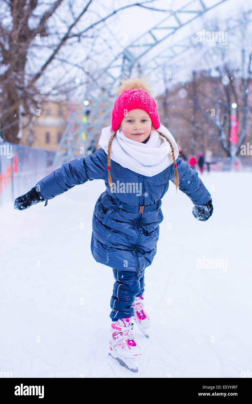Adorable little girl skating on the icerink Stock Photo Alamy