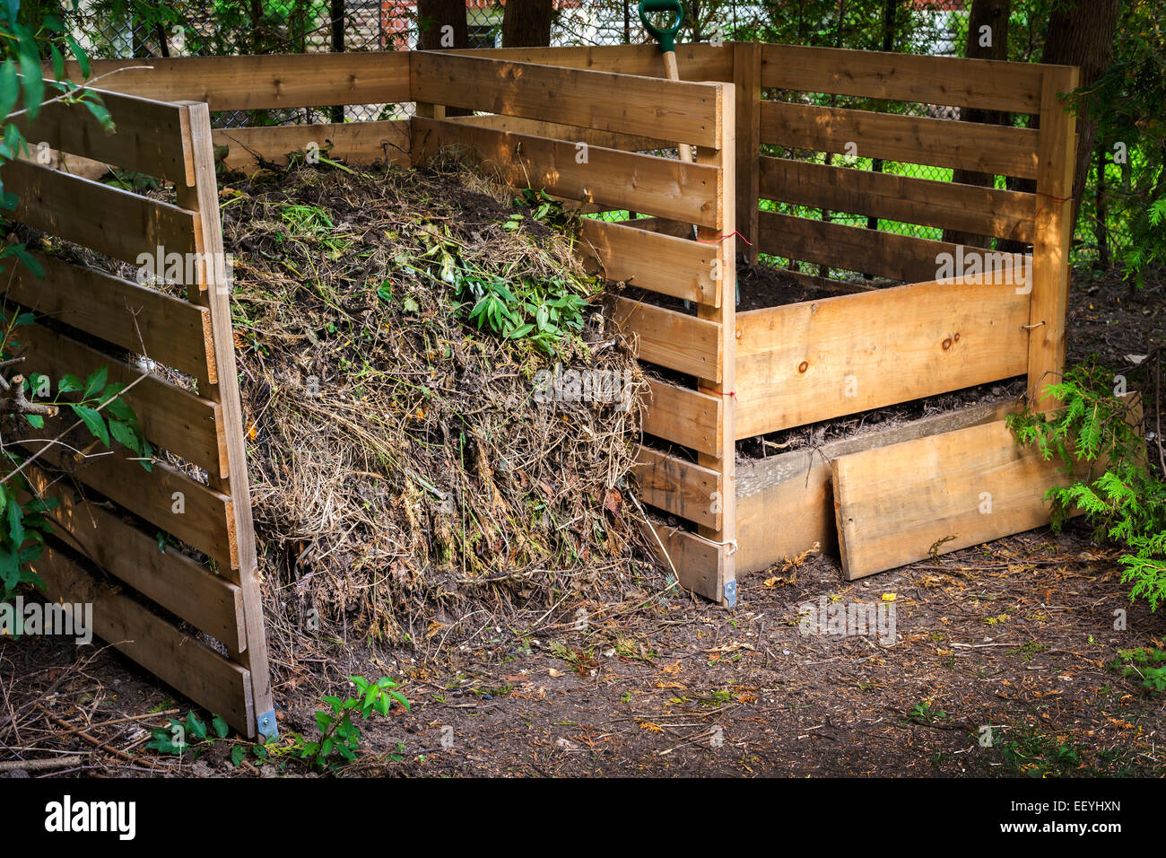 Wooden Compost Boxes With Composted Soil And Yard Waste For Garden