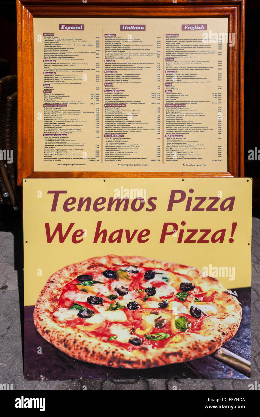 Restaurant Sign and Menu in Spanish, Italian, and English Announcing Pizza.  Playa del Carmen, Riviera Maya, Yucatan, Mexico. Stock Photo