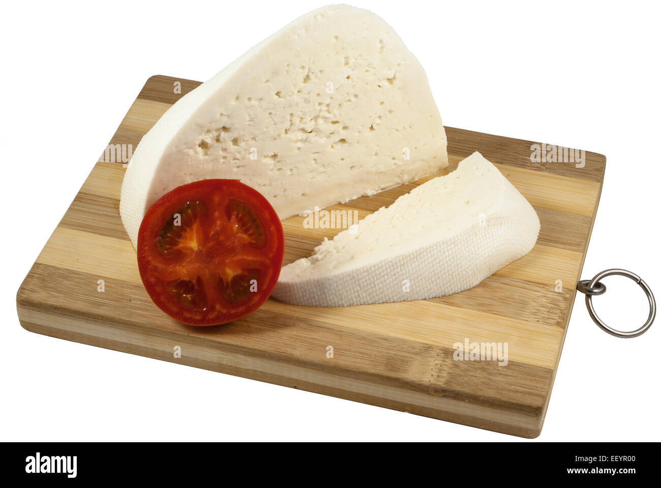 White cheese on wooden plate isolated over white background Stock Photo