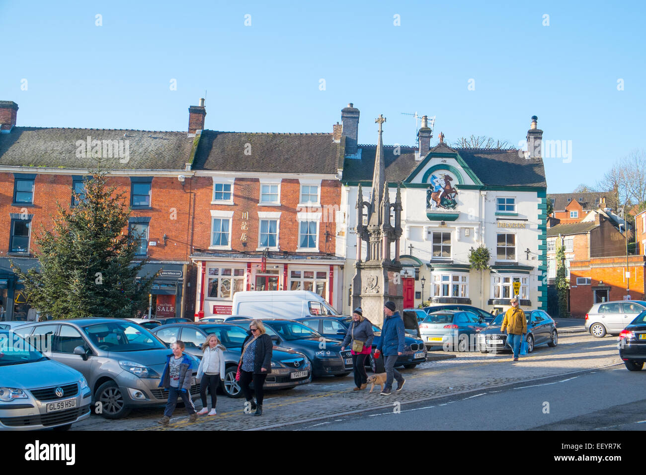 Ashbourne, a market town in Derbyshire,England family walking through town centre Stock Photo