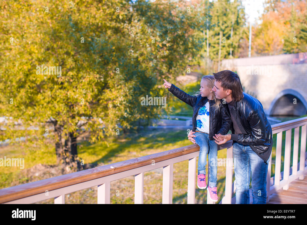 Father and cute daughter in autumn park outdoors Stock Photo - Alamy