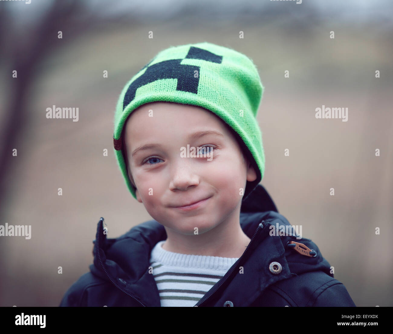 Portrait of young boy wearing green hat Stock Photo