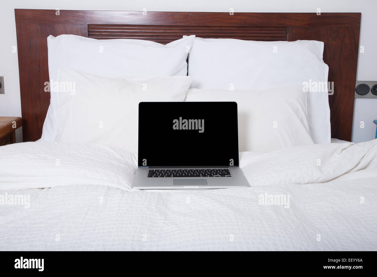 Blank Screen Grey Laptop Open Keyboard On White Bed With Pillow