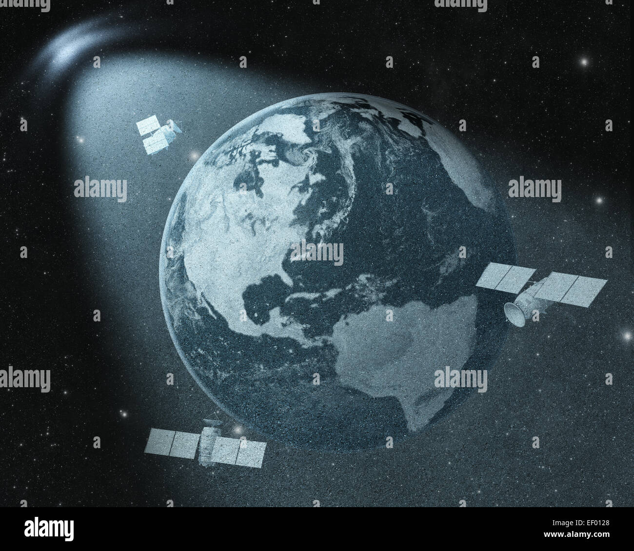 Earth and orbiting satellites drawing  in spot of light Stock Photo