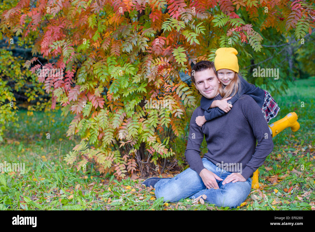 Young father with cute daughter in autumn park outdoors Stock Photo - Alamy