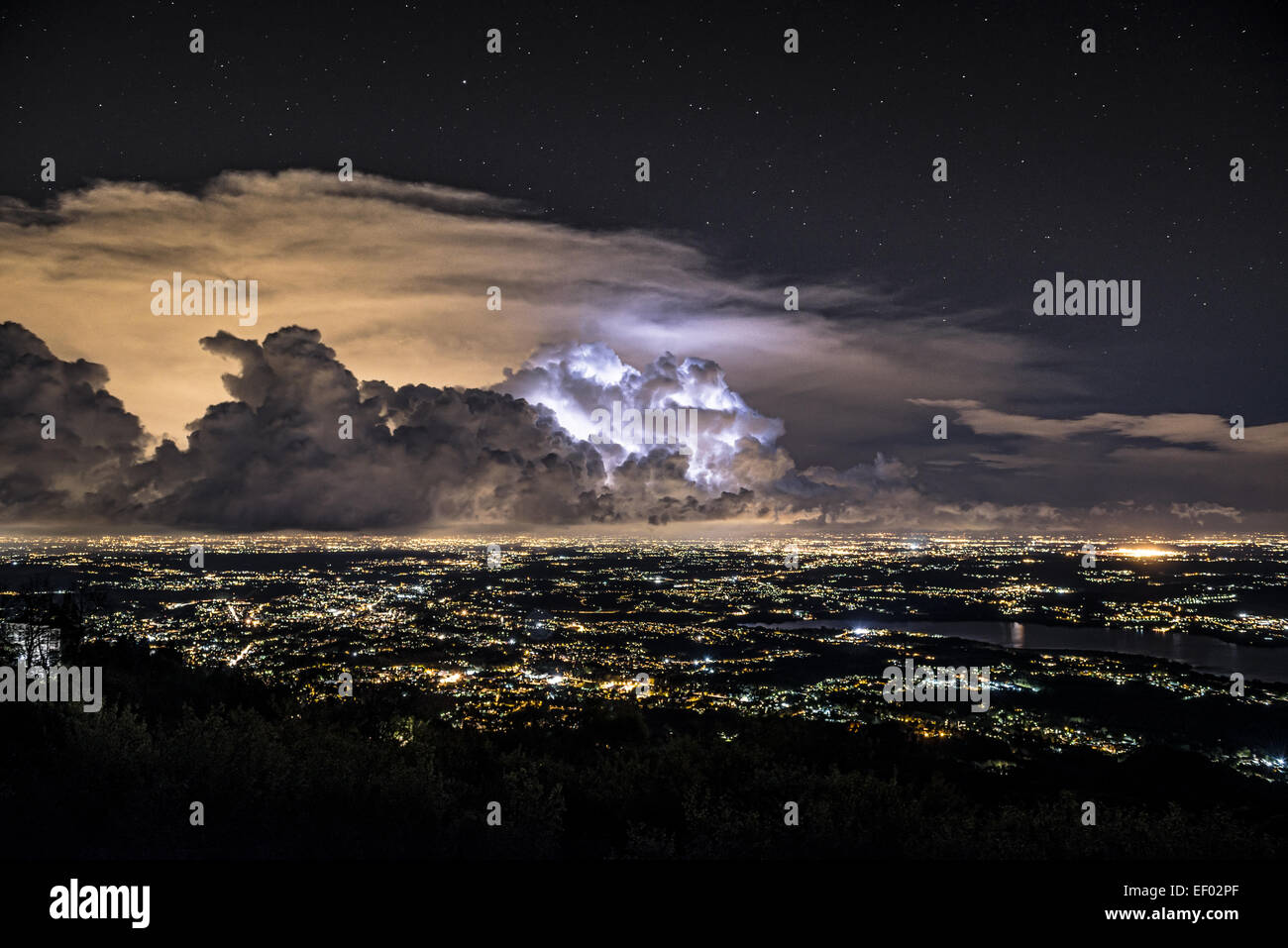 Thunderstorm at the horizon, Varese city - Lombardy, Italy Stock Photo