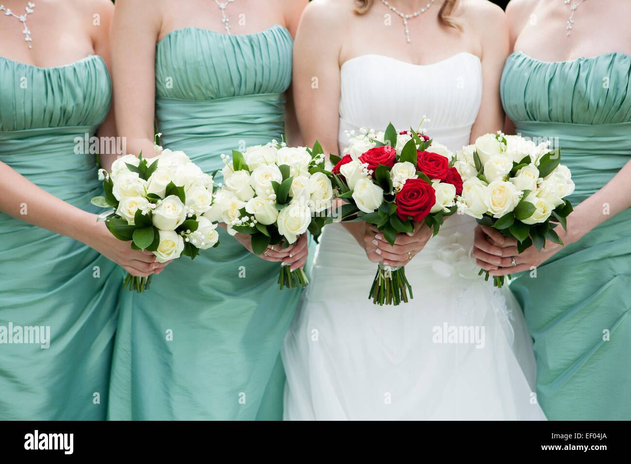 Close Up Of Bride And Bridesmaids Holding Flowers Stock Photo - Alamy