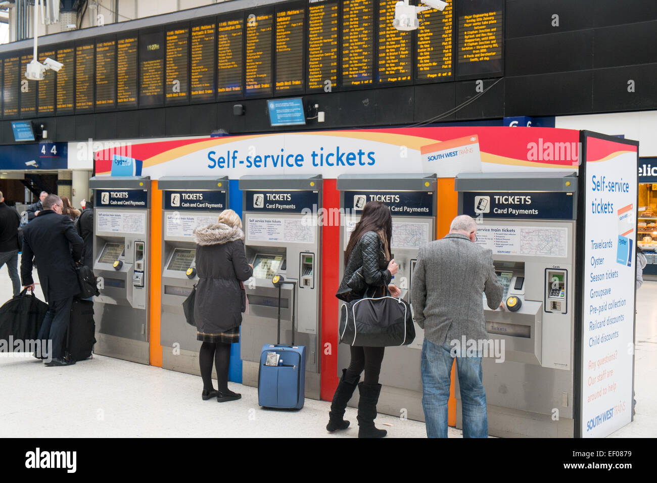 People buying their rail travel tickets at London waterloo railway train  station,england Stock Photo - Alamy