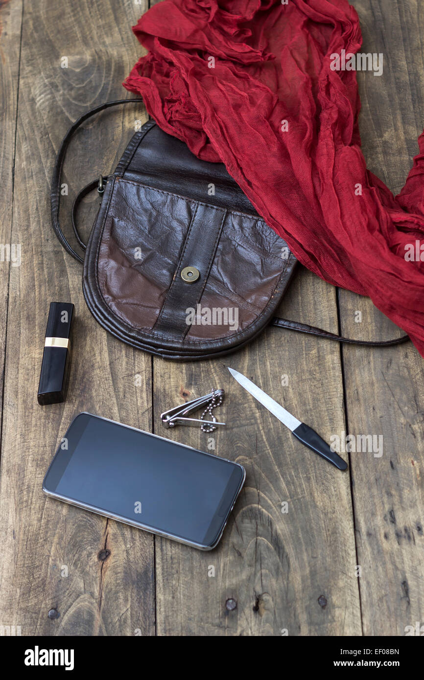 woman bag stuff, handbag on wooden background Stock Photo