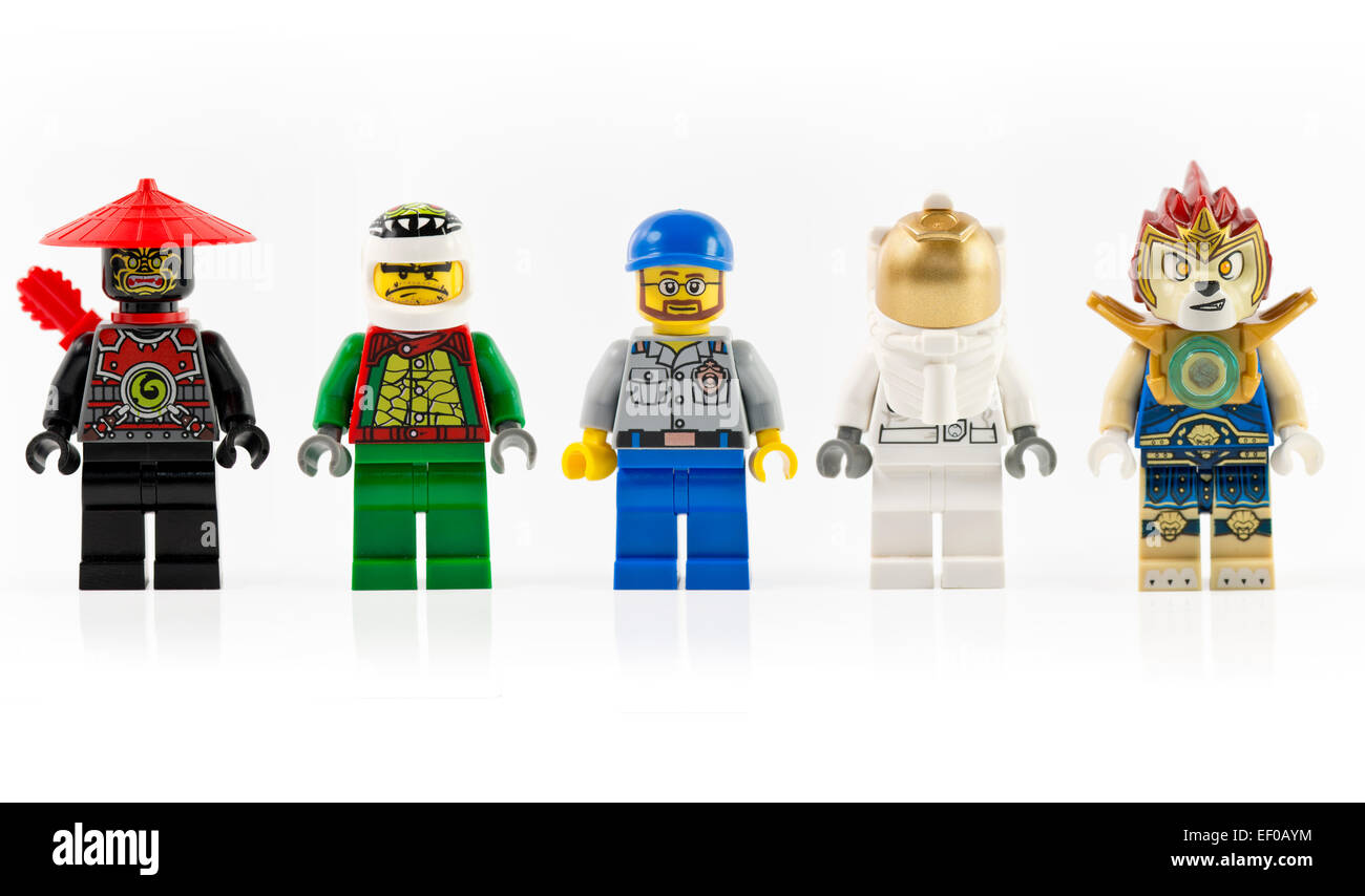 A group of five various lego mini characters isolated on white. Lego is a popular line of Stock Photo