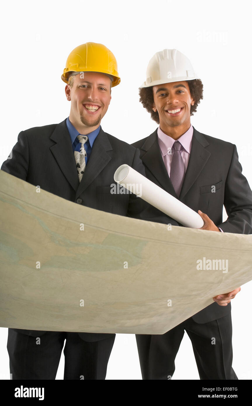 Two architects looking at blueprints Stock Photo
