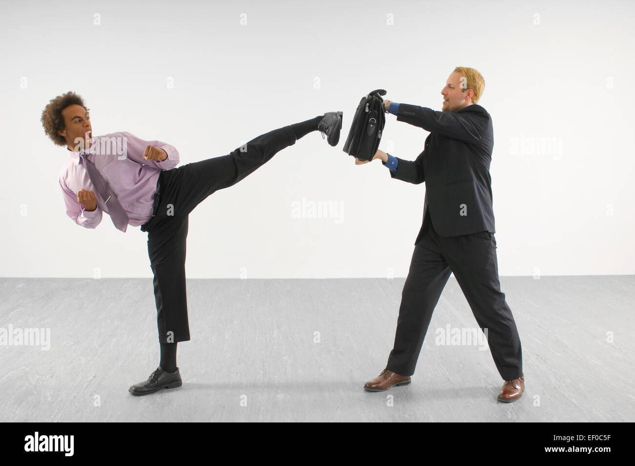 Two business people fighting Stock Photo Alamy
