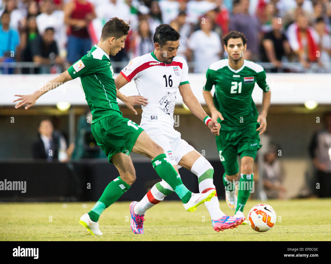 Canberra, Australia. 23rd Jan, 2015. Reza Ghoochannejhad (16) of Iran takes the ball across the Iraqi defines in the FIFA Asian Football Confederation 2015 Asian Cup quarter-final game played in Canberra Stadium, Canberra, Australia © Action Plus Sports/Alamy Live News Stock Photo