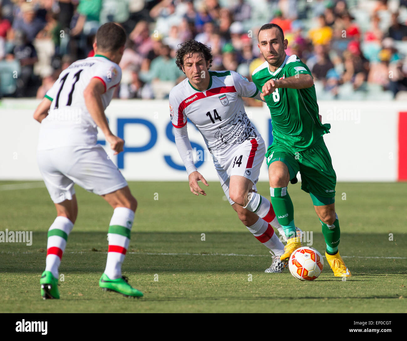 Canberra, Australia. 23rd Jan, 2015. Dhurgham Ismail (15) of Iraq works past Andranik Teymourian (14) of Iran in the FIFA Asian Football Confederation 2015 Asian Cup quarter-final game played in Canberra Stadium, Canberra, Australia © Action Plus Sports/Alamy Live News Stock Photo