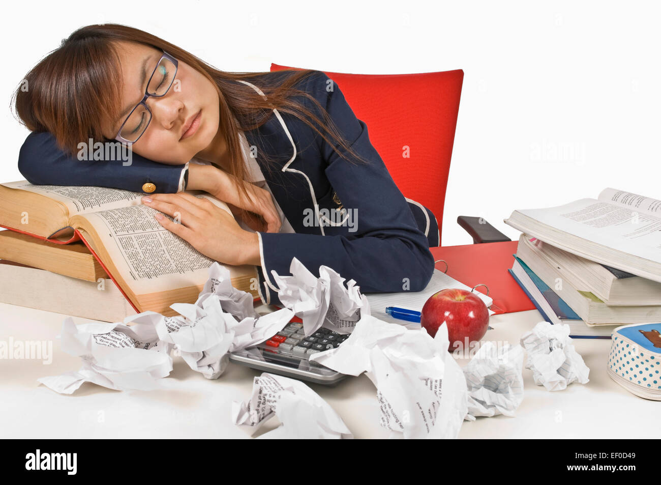 Teenage student sleeping at her desk Stock Photo