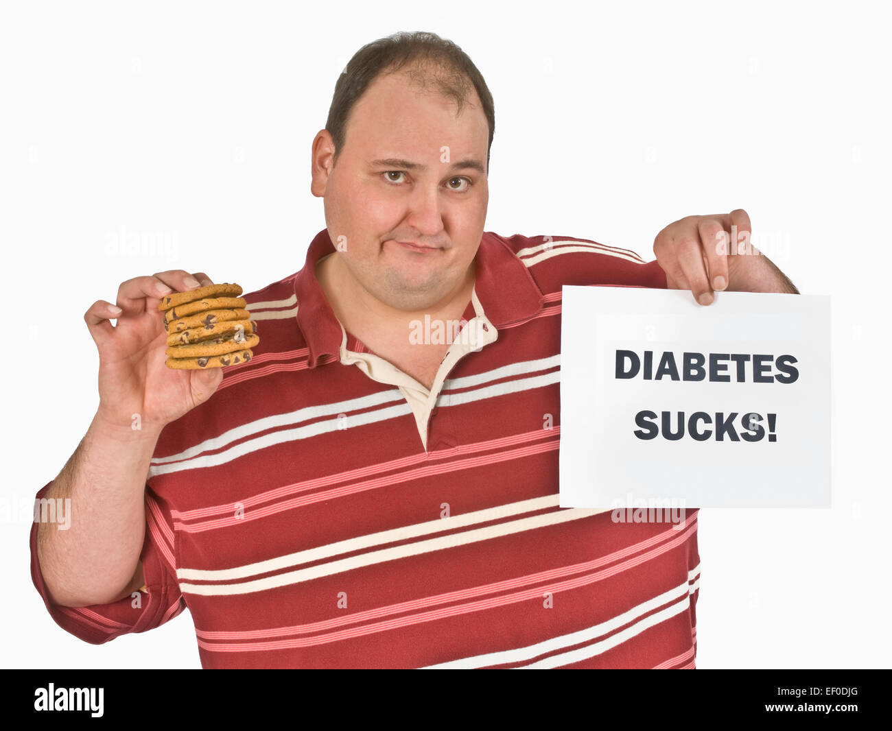 Man with diabetes holding a stack of chocolate chip cookies Stock Photo