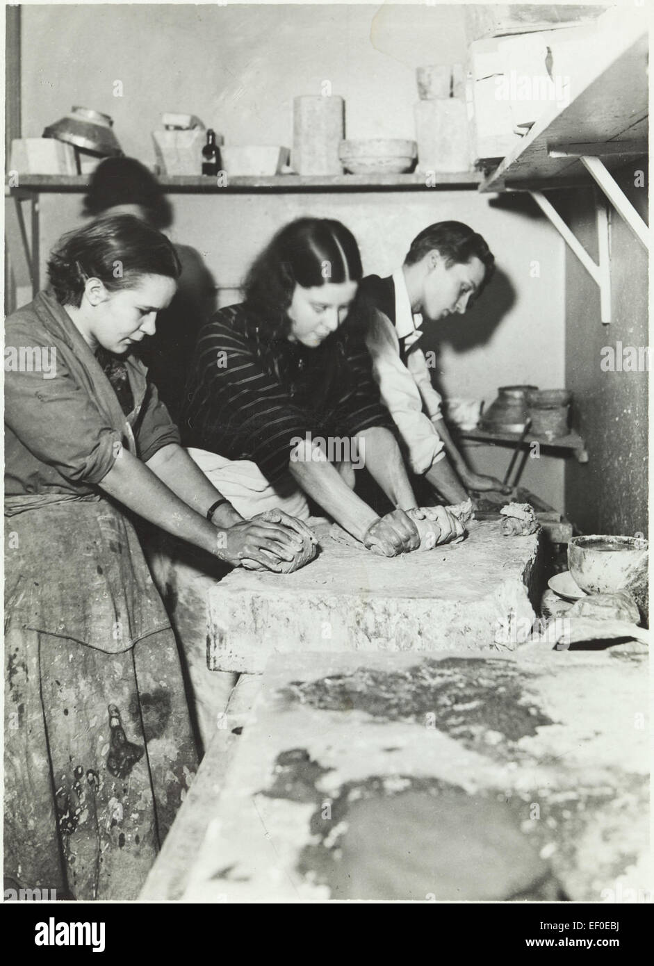 Pottery making, kneading the clay Stock Photo Alamy