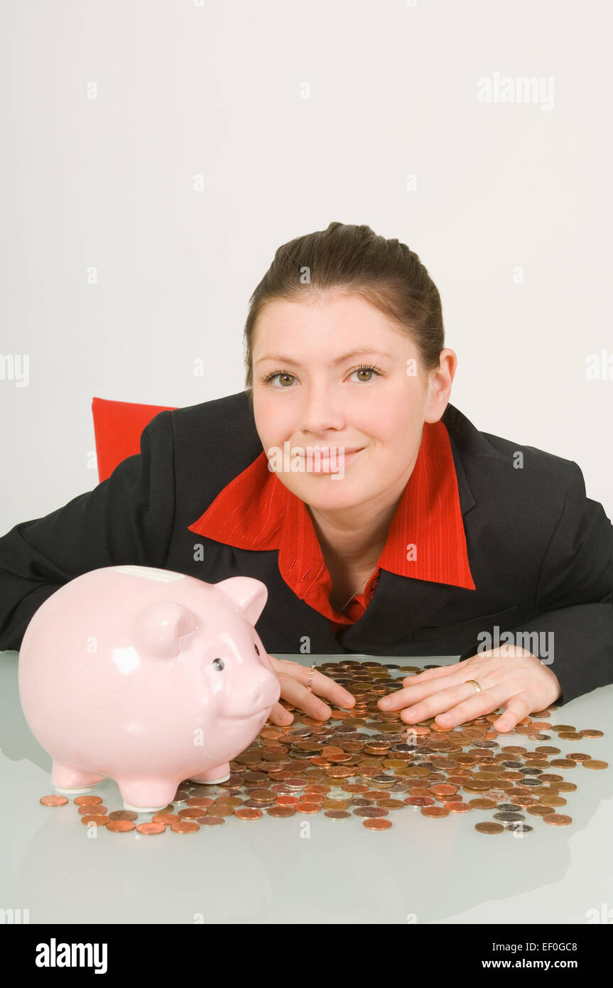 Businesswoman with hands on top of a pile of pennies Stock Photo