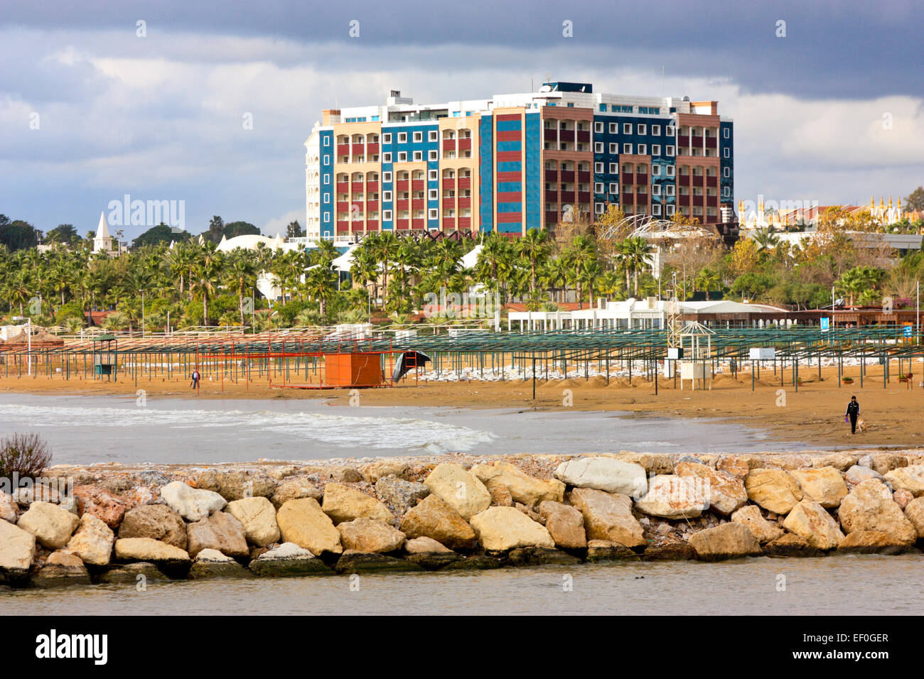 Breakwater in front of the beach, hotel complex in the background, Evrenseki, Side, Turkey Stock Photo