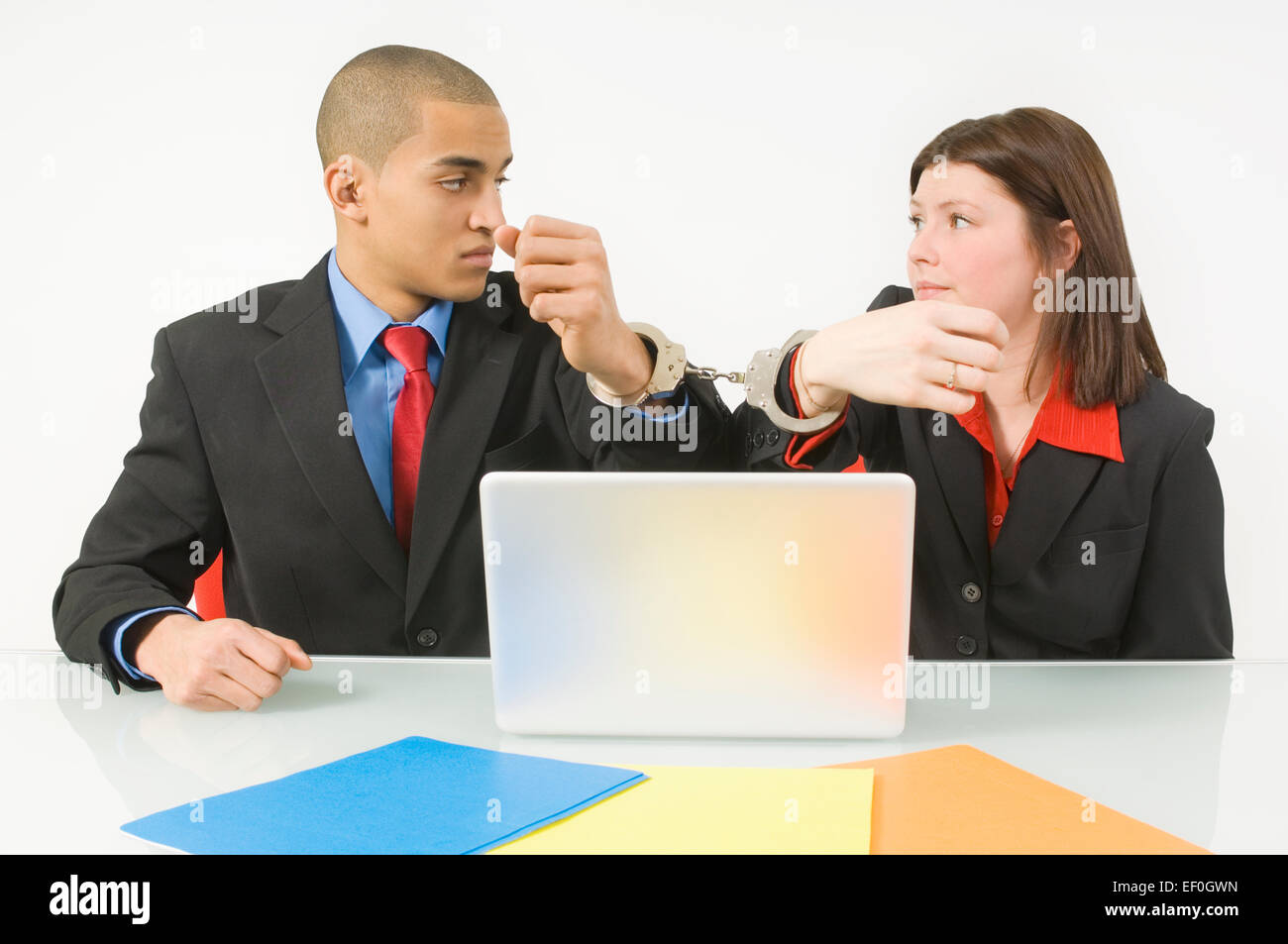 Two people handcuffed together hi-res stock photography and images - Alamy