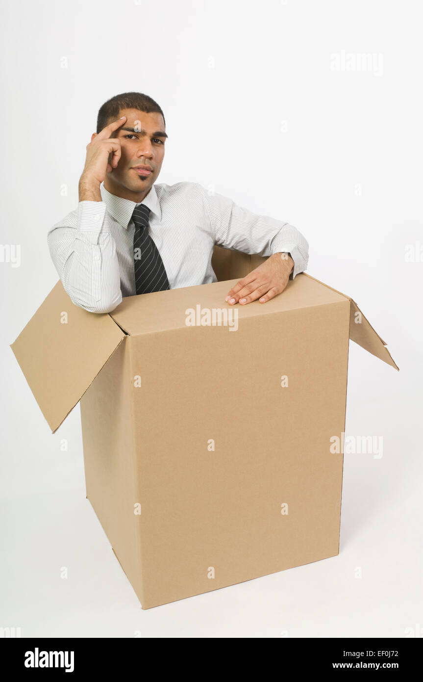 Man sitting in a cardboard box Stock Photo - Alamy
