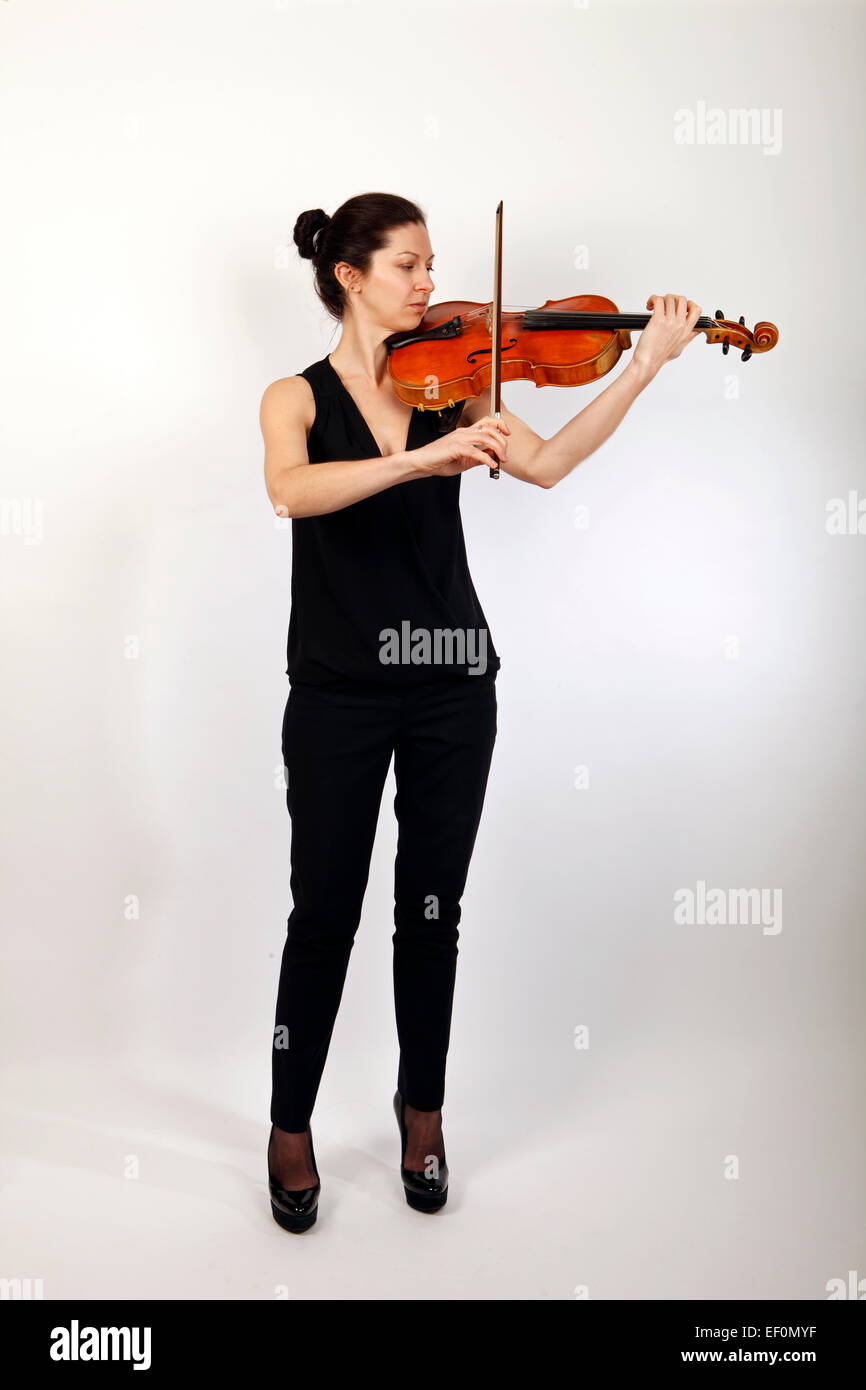 Viola player, playing her musical instrument Stock Photo
