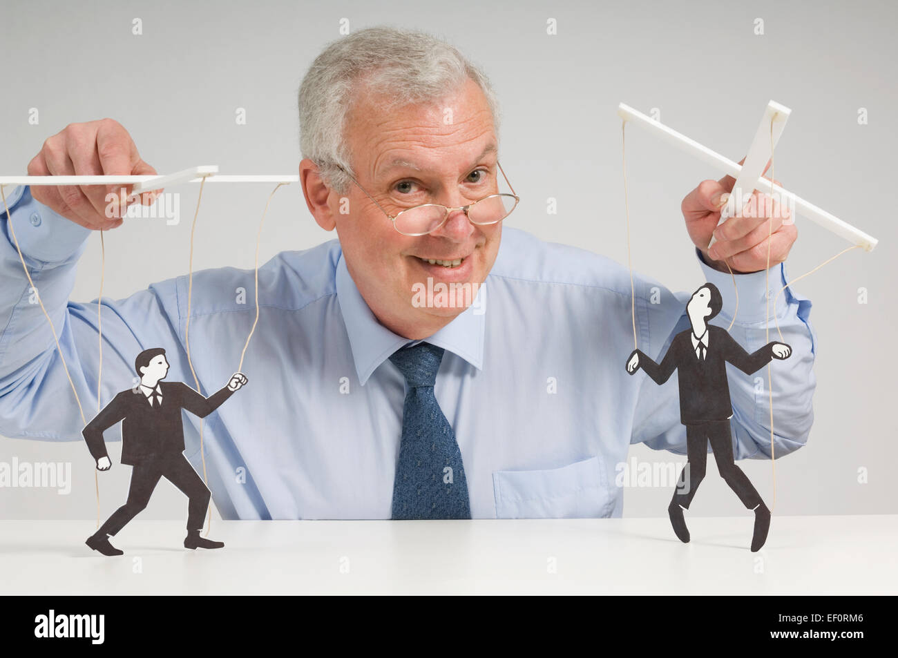 Man playing with puppets Stock Photo